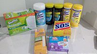 Overview of all 9 cleaning products including Swiffer refills, Lysol wipes, Invisible Glass spray, Arm & Hammer baking soda, SOS steel wool pads, and disposable wipes.