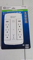Photo of Commercial Electric Wall Tap Surge Protector model 1001 004 081 in packaging showing 6 outlets and 2 USB ports with information about surge protection.