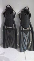 Front view of left and right black Scubapro Twin Jet Max dive fins showing adjustable straps and blade design.
