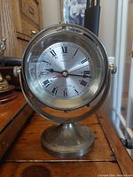 Front view of the solid brass nautical ships time quartz clock with visible dial and hands.