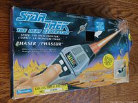 Original box for the Star Trek The Next Generation Phaser toy showing artwork, product name, and collector's edition number.