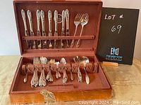 Full view of the vintage silver plate cutlery set with forks, knives, various spoons, and serving utensils in original wooden box.