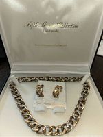 Full jewelry set inside white soft-lined box with Fifth Avenue Collection branding: necklace and pierced earrings arranged inside.