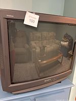 Front view of Sony Trinitron CRT TV showing curved screen and the Sony logo with Trinitron branding.