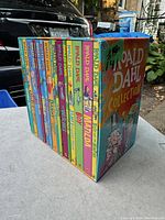 Front view showing the full set of Roald Dahl books neatly arranged in a colorful collector box titled 'Roald Dahl Collection'.