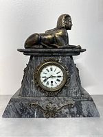 Frontal view of the marble clock with sphinx figure and dial