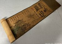 Partially unrolled handscroll showing calligraphy and architectural scene