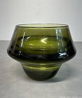 Front view of olive green glass bowl showing flared shape and smooth surface
