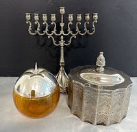 Overview of the lot showing menorah, amber glass covered dish, and silver plated jewelry box