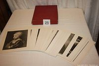 Photo showing the collection of vintage black and white prints by Perry Picture Company spread out with a reference box in background