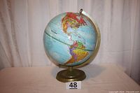 Full view of the desktop globe showing the Americas and part of the base with lot number marker