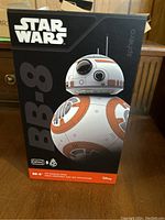Front view of unopened BB-8 droid box with product image and Star Wars branding.