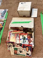 Box labeled $2.00 hockey cards containing packed NHL hockey cards from 1990-1995