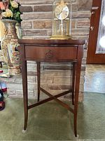 Deilcraft dark wood occasional table with single drawer and tapered legs, glass top protector visible