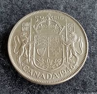 Obverse side showing the 1946 Canadian 50 cent silver coin with coat of arms and denomination