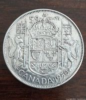 Reverse side of 1950 Canadian silver 50 cent coin showing Canadian coat of arms, denomination, and year.