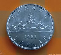 Reverse side of 1963 Canadian silver dollar with canoe design and date