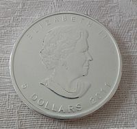 Obverse of the 2011 Canadian silver coin showing portrait of Queen Elizabeth II with denomination and year.