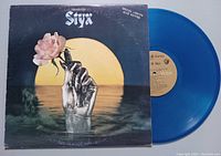 Front view of the album cover with 'Best of Styx' and 'Special Limited Blue Edition' text showing, alongside the blue vinyl record partially visible.