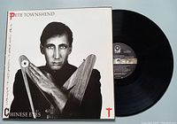 Front cover of the album showing Pete Townshend in black and white holding a wooden V-shaped object with the album and artist name.