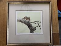Full view of framed print showing mouse on branch with beige mat and gold-finished frame