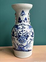 Front view of the full-height vase showing overall shape, decoration and handles