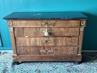 Front elevation view of commode showing four drawers, marble top and gilt mounts