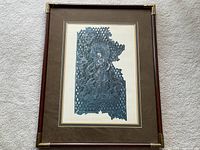 Full view of framed Buddhist print showing the entire artwork with the mahogany frame and brass corners.