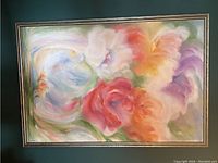 Full view of framed floral painting against dark green wall