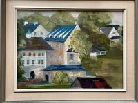 Front view of the framed oil painting showing houses and trees in a soft impressionistic style with visible brush strokes and earth-tone colors.