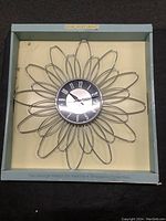 George Nelson design wire flower shaped wall clock from Verichron collection in box.