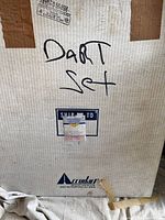Shipping box with the handwritten text 'Dart Set' and Accudart logo visible.