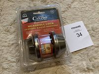 Front view of CAN-PRO single cylinder deadbolt lock in original blister packaging.