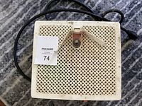 Top view of the glass grinder showing ventilation holes and power cord.