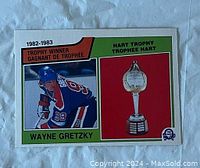 Front of 1983-84 O-Pee-Chee Wayne Gretzky hockey card showing photo, Hart Trophy image, and text