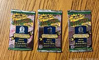 Front view of three sealed All Sports Unlimited trading card packs with promotional branding and vintage memorabilia mention.