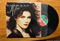 Front of Alannah Myles vinyl album cover with record partially visible inside a plastic inner sleeve.