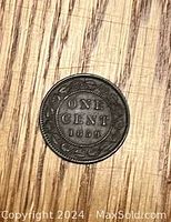 Reverse side showing ONE CENT 1859 inside wreath and CANADA legend