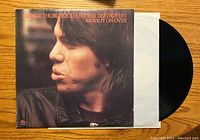 Front cover of George Thorogood and The Destroyers vinyl album Move It On Over, showing side profile image of George Thorogood.