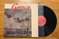 Front side of Gowan Strange Animal album cover with record partially visible.