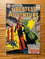 Front cover of My Greatest Adventure #79 comic book showing a dinosaur with rockets and a man running, with the story title 'Countdown in Dinosaur Valley'