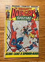 Front cover of The Mighty Avengers Special #5 comic showing main Avengers characters and Spider-Man on a web design.