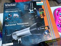 Original box of Vivitar microscope with 300x/450x/600x magnifications and refractor telescope with 20x/30x/40x magnifications, includes tripod.