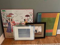 Four framed artworks grouped: John Lim print, abstract print, two photographic prints