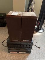 Photo showing the full stereo set including two wood cabinet Koss speakers on top of the Aiwa receiver and cassette tape deck unit below.