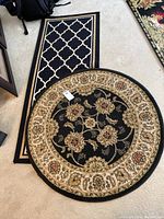 Photo of the round area rug with floral pattern and rectangular lattice runner together showing size relative to each other.