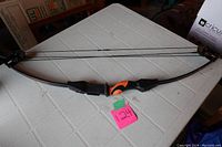 Full view of Barnett Banshee Quad compound bow showing grip, limbs and quads.