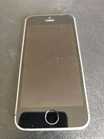 Front side of Apple iPhone SE showing the screen with home button and Touch ID sensor, black screen off state with some dust.