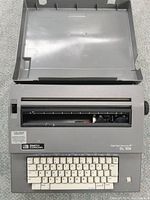 Top view of Smith Corona Seal Right SL 105 electric typewriter showing keyboard, platen roller, and body.