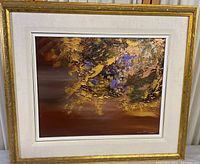 Framed full view of original modern abstract painting featuring metallic gold accents and purple hues.
